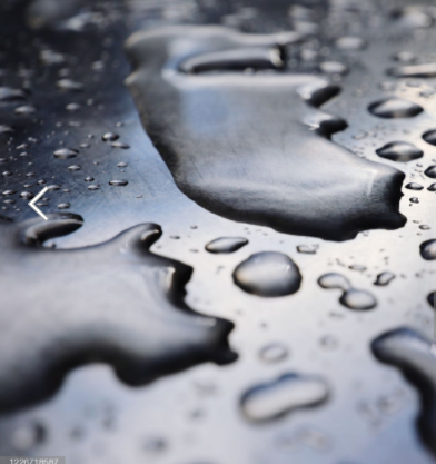 A puddle of water inside a garage shelter, which could harm its long-term maintenance.