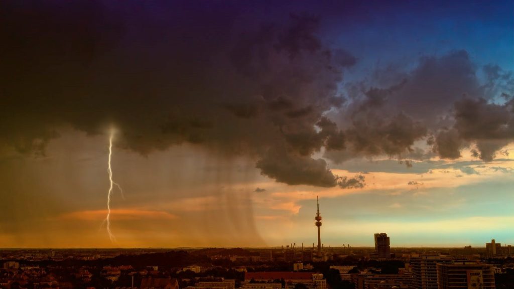 Dark clouds and lightning over a city