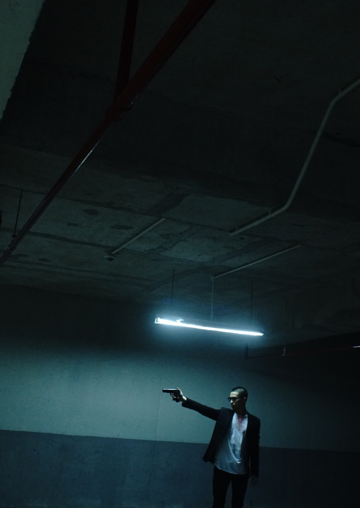 Armed man in an underground garage shelter