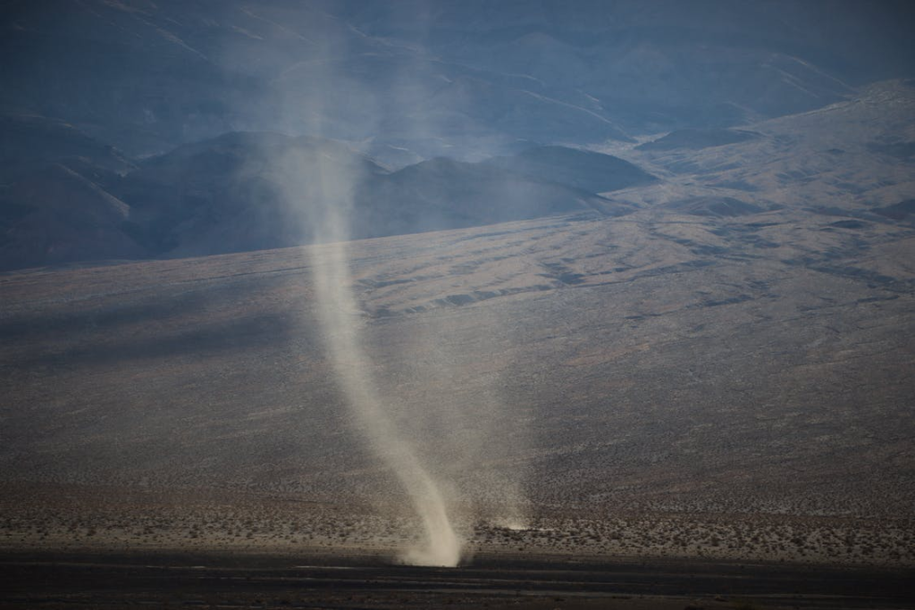 Tornado Hitting A Brown Field