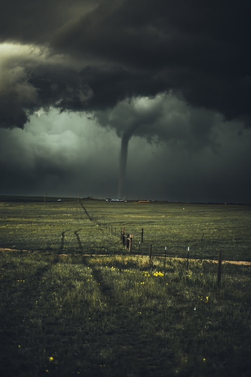 A tornado in an open field.