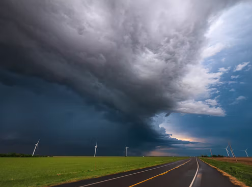 A highway scene with dark clouds