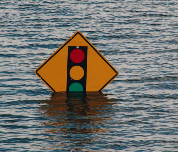 A signboard for traffic lights floating on water