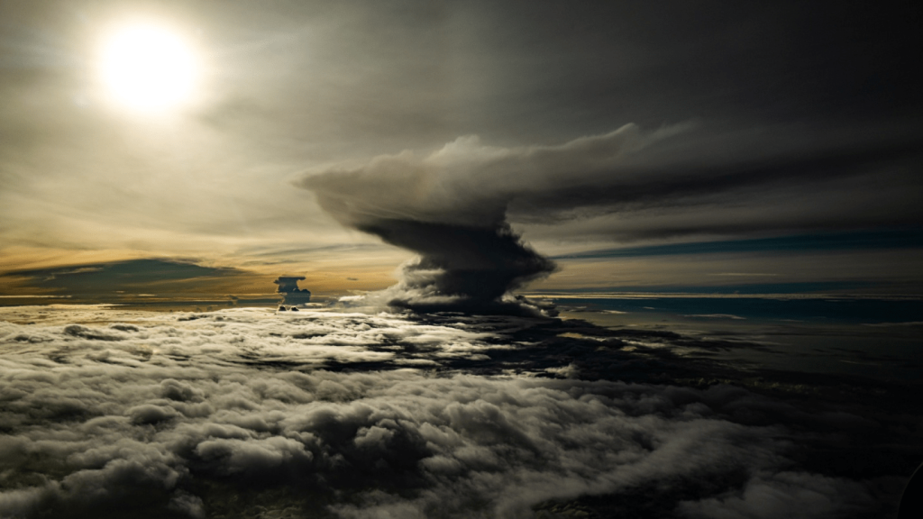 A tornado building up over the countryside