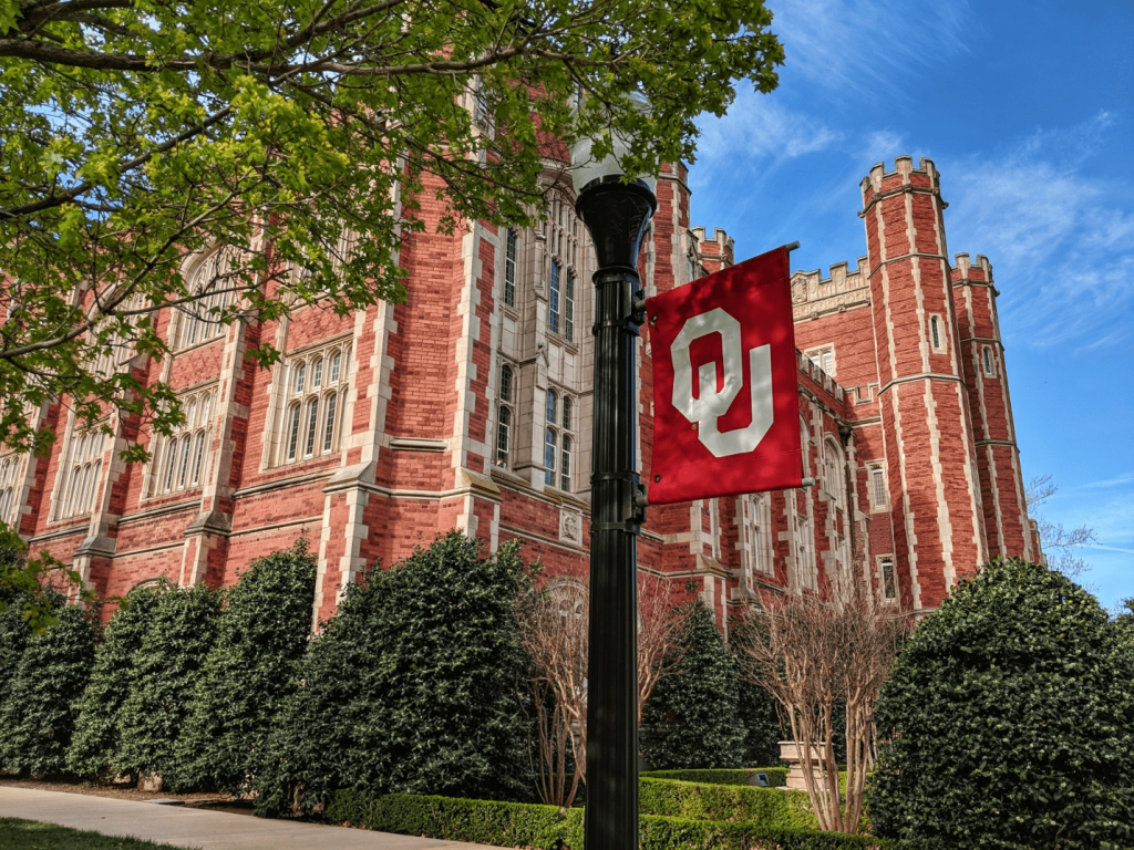 Red building with a flag in Norman City