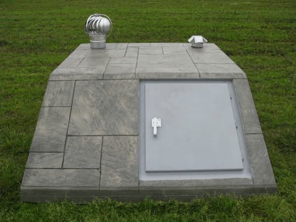 An underground concrete storm shelter.