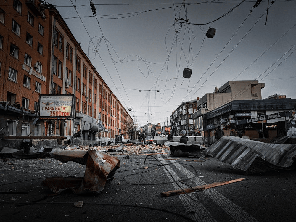 City street covered in storm debris and destroyed elements after severe weather