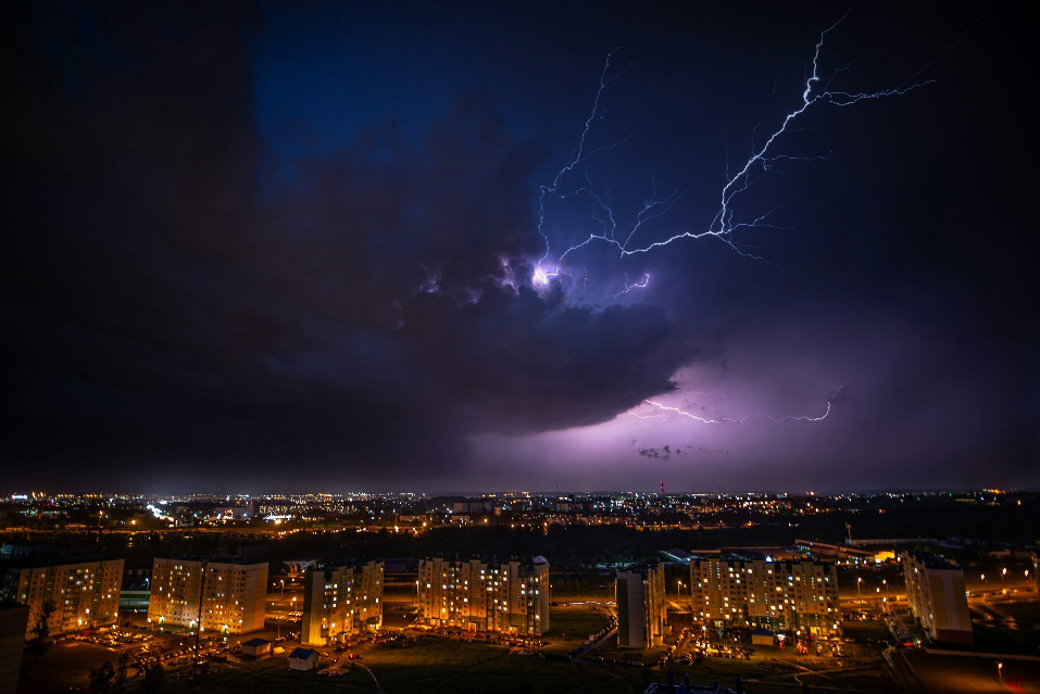 A severe storm over a big city at night