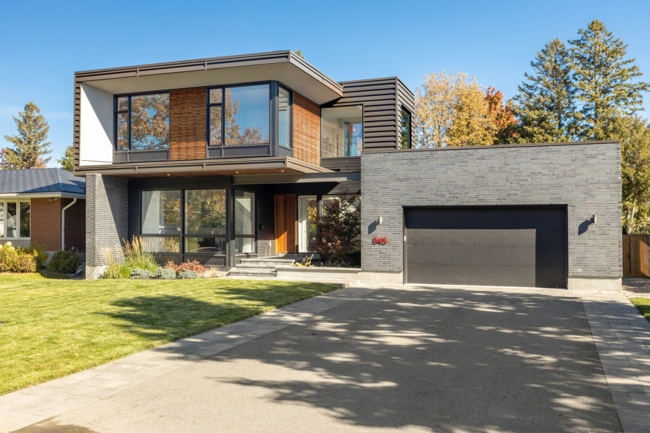 A suburban home with a driveway and attached garage