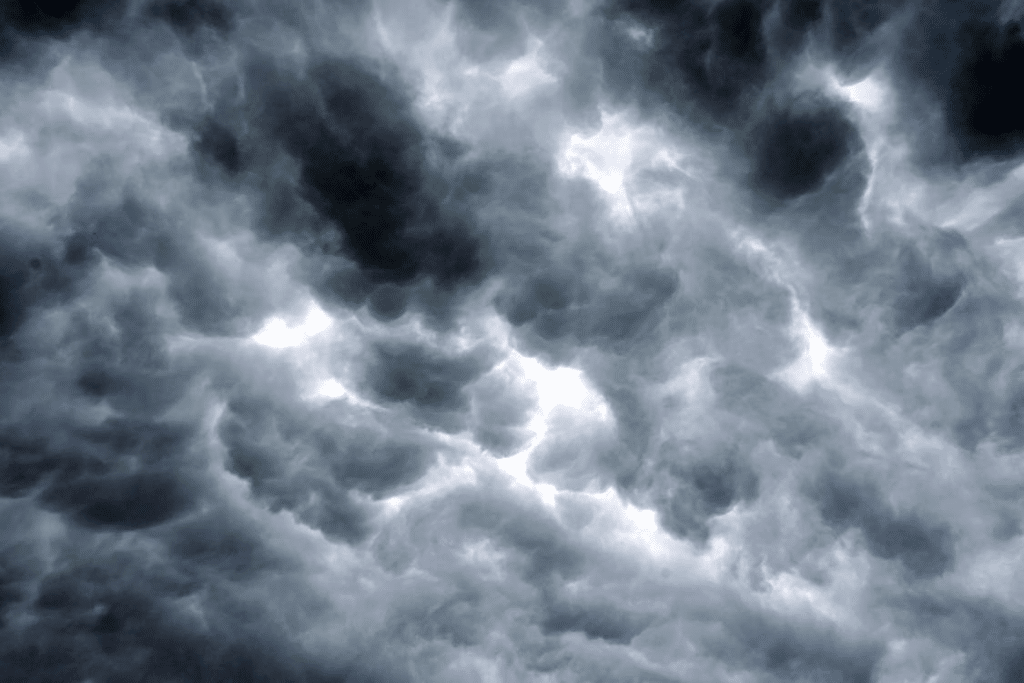 Dark storm clouds filling a moody, overcast sky