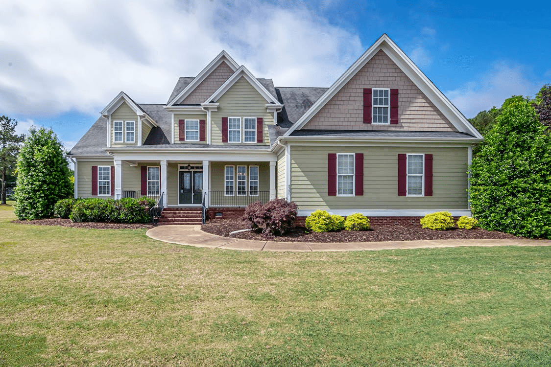 Suburban American family home with a front yard and neutral siding