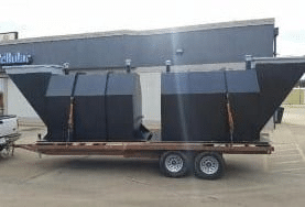 Oklahoma storm shelter units loaded on a trailer, ready for delivery and installation.
