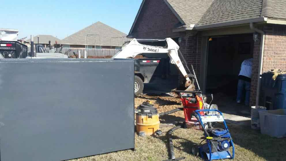 A garage storm shelter is being installed on someone’s property