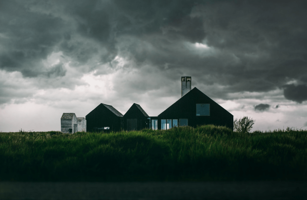 A house under thick clouds.