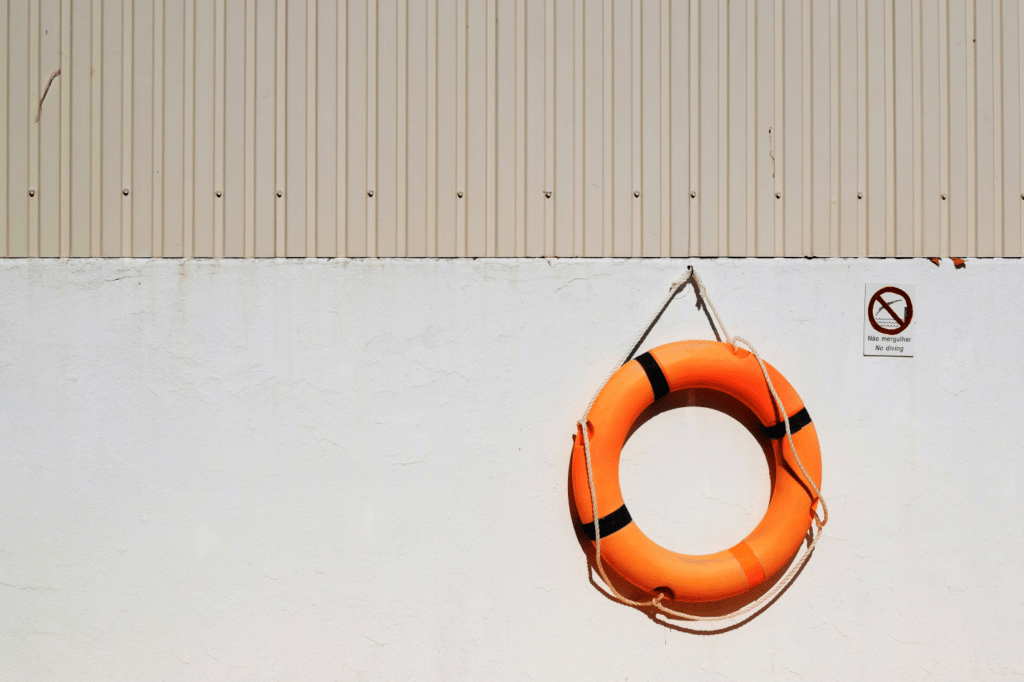 Orange tube hanging on a wall