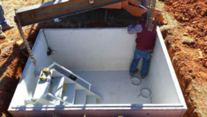 A steel safe room with a staircase installed in the ground