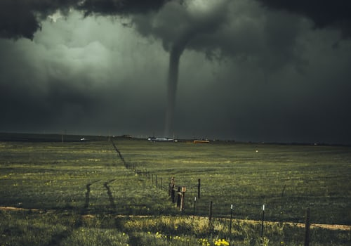 A tornado in an open field.