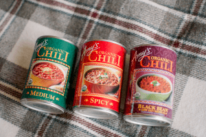 three cans of canned chili