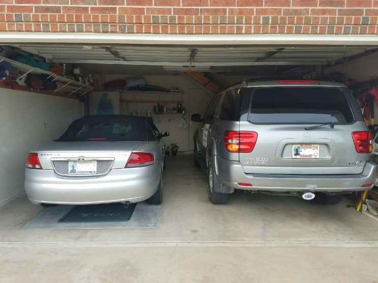 Cars parked above a garage shelter.