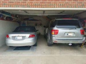 Cars stored inside a garage with garage shelter underneath in OKC