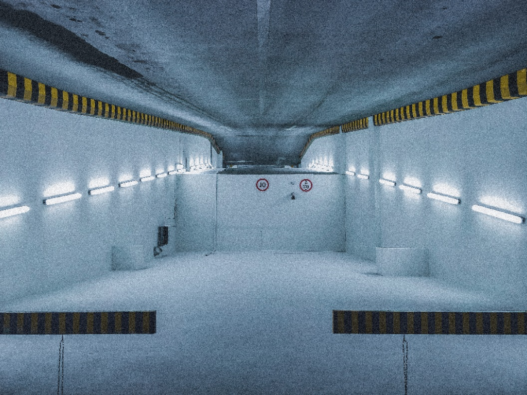 Spacious concrete storm shelter with bright lighting