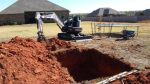 Digging the ground with a machine for placing underground bunker