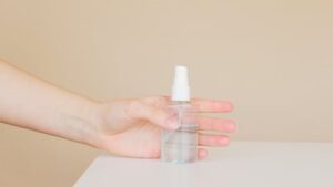 Make your disinfectant solution using alcohol or bleach, mixing it with water and putting them in spray bottles.