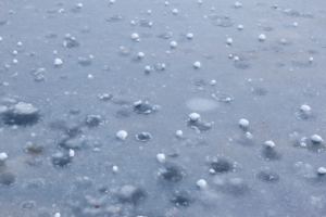Hailstones on ground after heavy rain