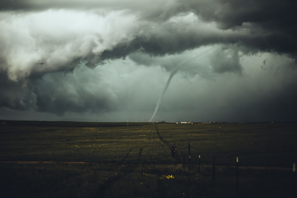 A huge rope tornado sight through a field
