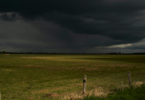 A storm building up across a vast field