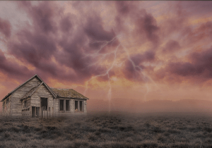 a house in a field during a storm